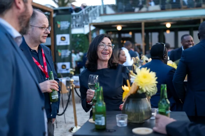 Mining professionals networking at an outdoor reception during Mining Indaba in Cape Town